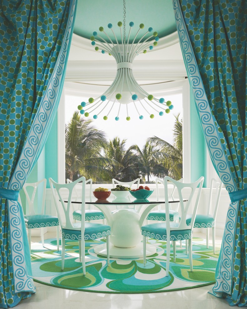 Tropical dining room in Miami with blue walls and no fireplace.