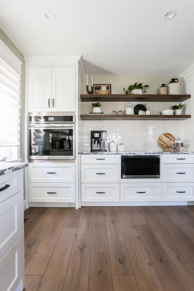 Example of a transitional kitchen design in Toronto