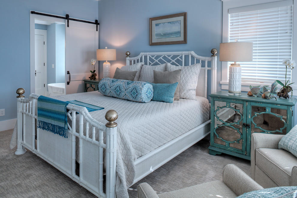 Inspiration for a beach style bedroom in Other with blue walls, carpet and grey floor.
