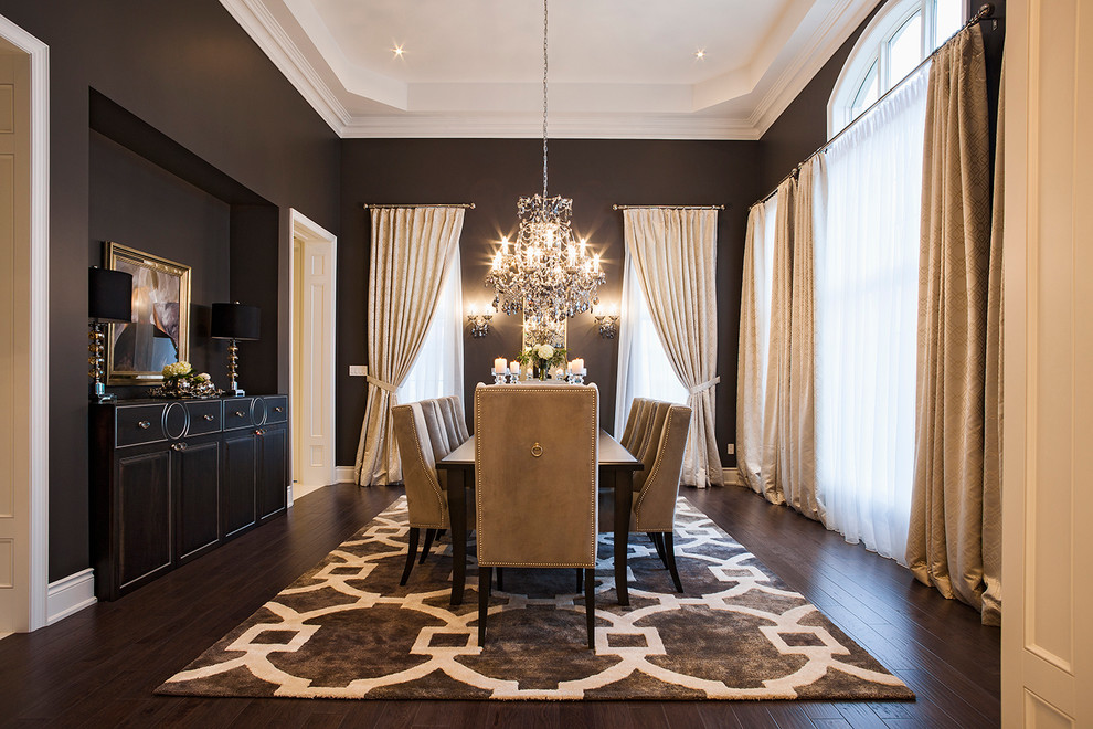 Large transitional separate dining room in Toronto with dark hardwood floors, no fireplace, brown floor and black walls.