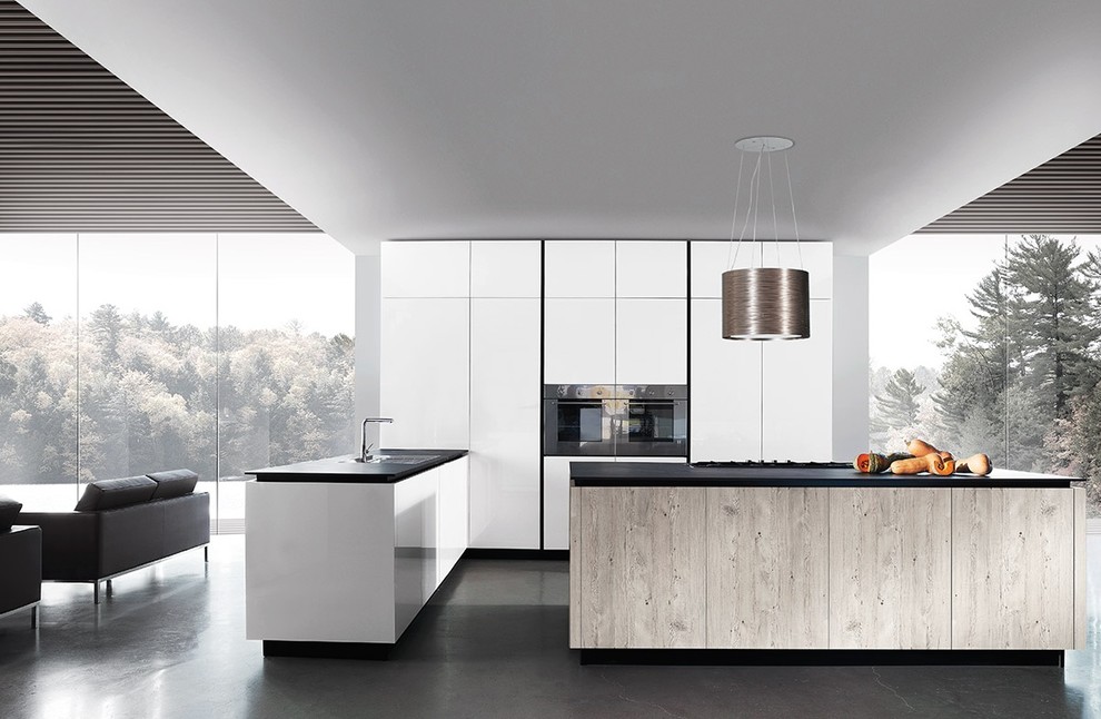 Design ideas for a mid-sized modern galley eat-in kitchen in Los Angeles with open cabinets, medium wood cabinets, wood benchtops, white splashback and multiple islands.