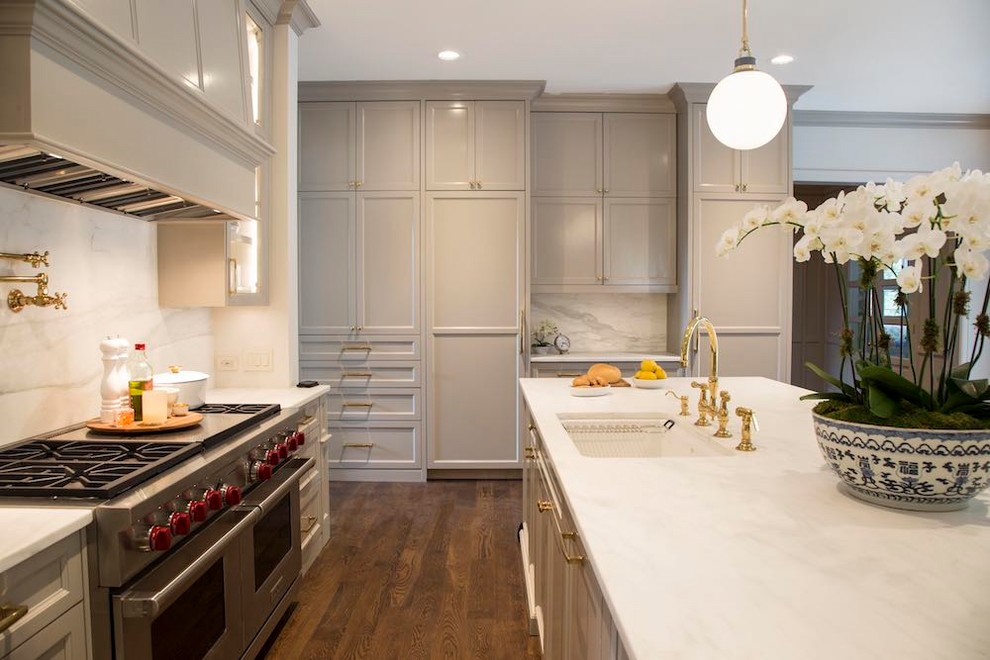 Inspiration for an expansive transitional kitchen in Austin with an undermount sink, recessed-panel cabinets, grey cabinets, marble benchtops, white splashback, marble splashback, stainless steel appliances, dark hardwood floors and with island.