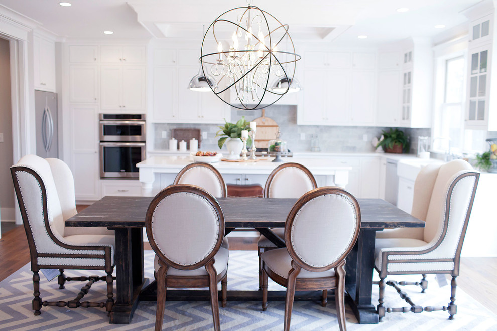Inspiration for a mid-sized transitional open plan dining in Minneapolis with white walls and medium hardwood floors.