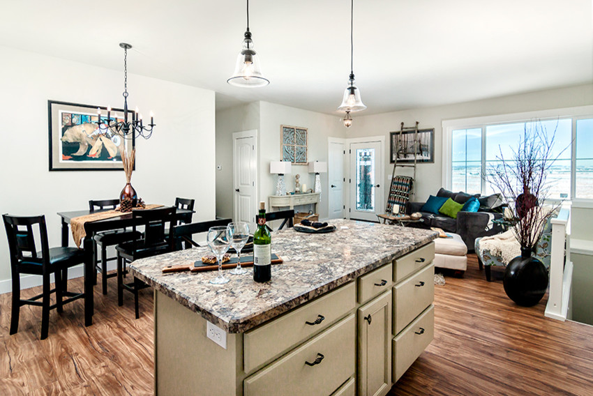 Mid-sized transitional l-shaped medium tone wood floor open concept kitchen photo with an undermount sink, recessed-panel cabinets, white cabinets, granite countertops, stainless steel appliances and an island