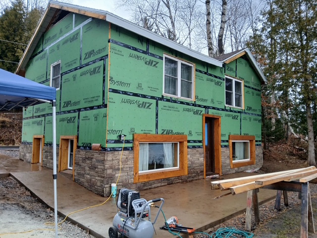 Log Siding, Stamped Concrete and Post and Beam Carport
