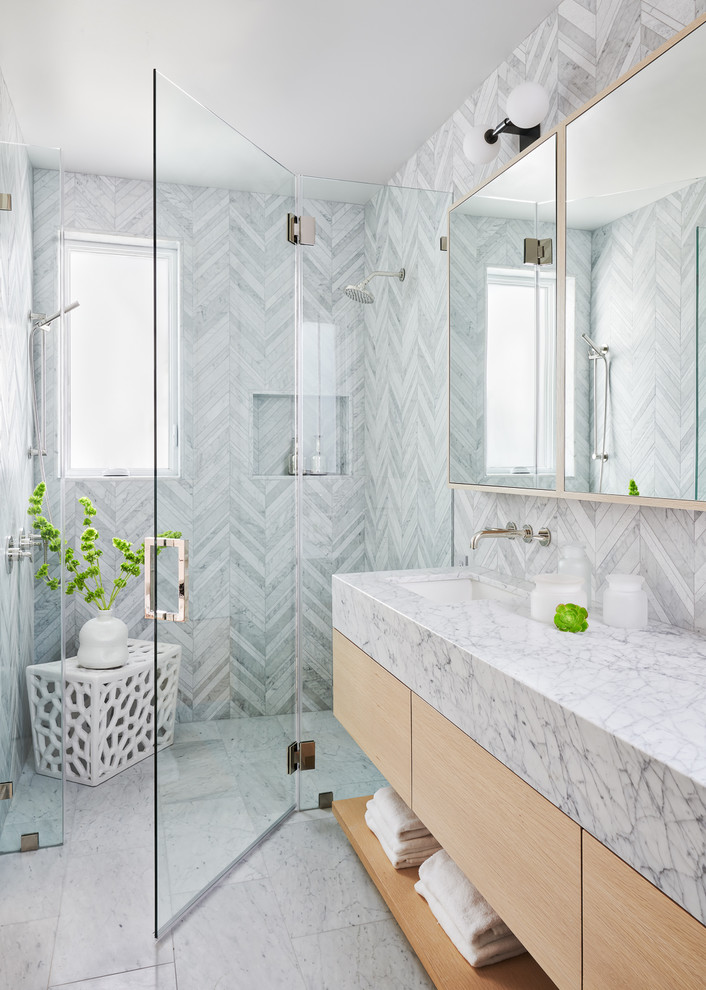 Design ideas for a transitional bathroom in San Francisco with open cabinets, light wood cabinets, an alcove shower, marble, grey walls, marble floors, an undermount sink, grey floor, a hinged shower door and grey benchtops.