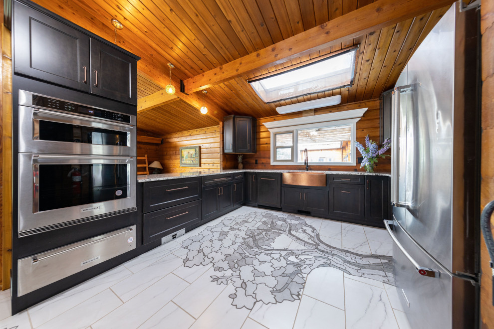 Mid-sized mountain style u-shaped ceramic tile, multicolored floor and exposed beam eat-in kitchen photo with paneled appliances, a farmhouse sink, shaker cabinets, distressed cabinets, granite countertops, gray backsplash, ceramic backsplash, no island and multicolored countertops