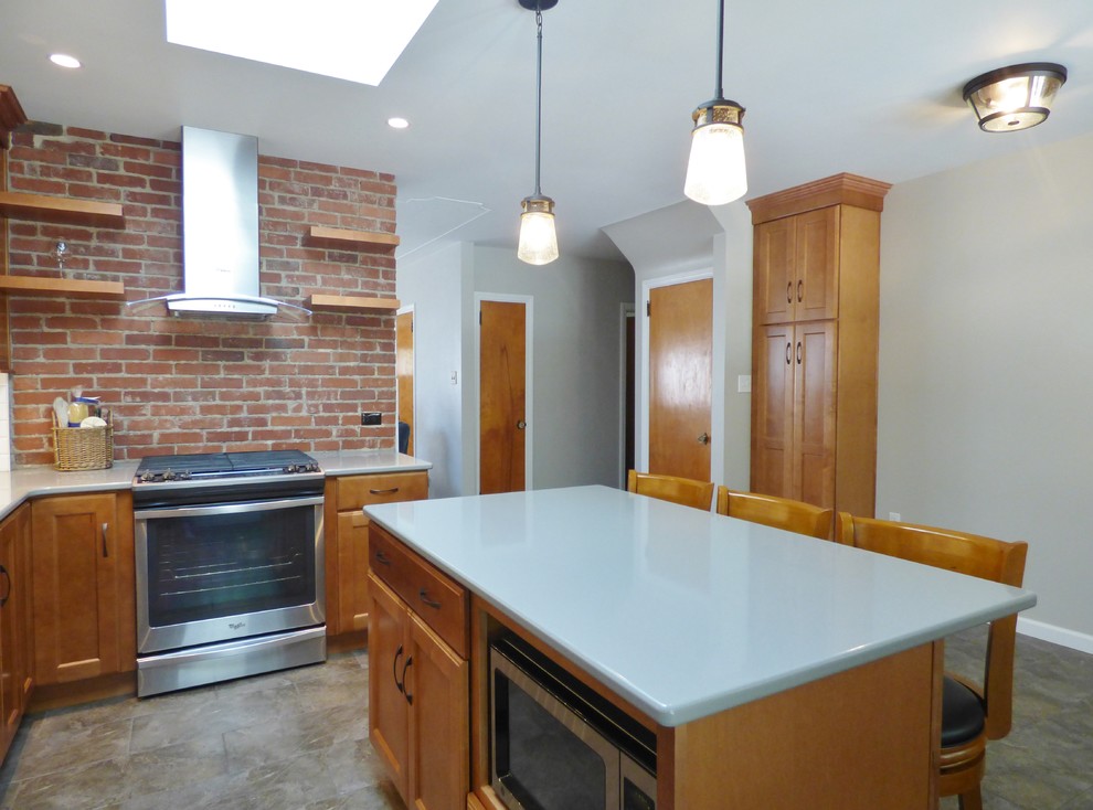 Example of a transitional l-shaped porcelain tile eat-in kitchen design with an undermount sink, recessed-panel cabinets, medium tone wood cabinets, quartz countertops, white backsplash, subway tile backsplash, stainless steel appliances and an island