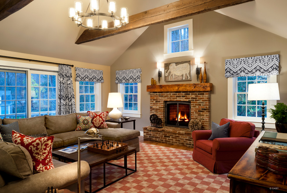 Inspiration for a mid-sized traditional open concept family room in Boston with beige walls, dark hardwood floors, a standard fireplace and a brick fireplace surround.