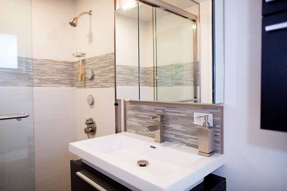 Inspiration for a small transitional master bathroom in San Francisco with flat-panel cabinets, dark wood cabinets, an alcove shower, a two-piece toilet, beige tile, glass tile, white walls, porcelain floors, an integrated sink and engineered quartz benchtops.