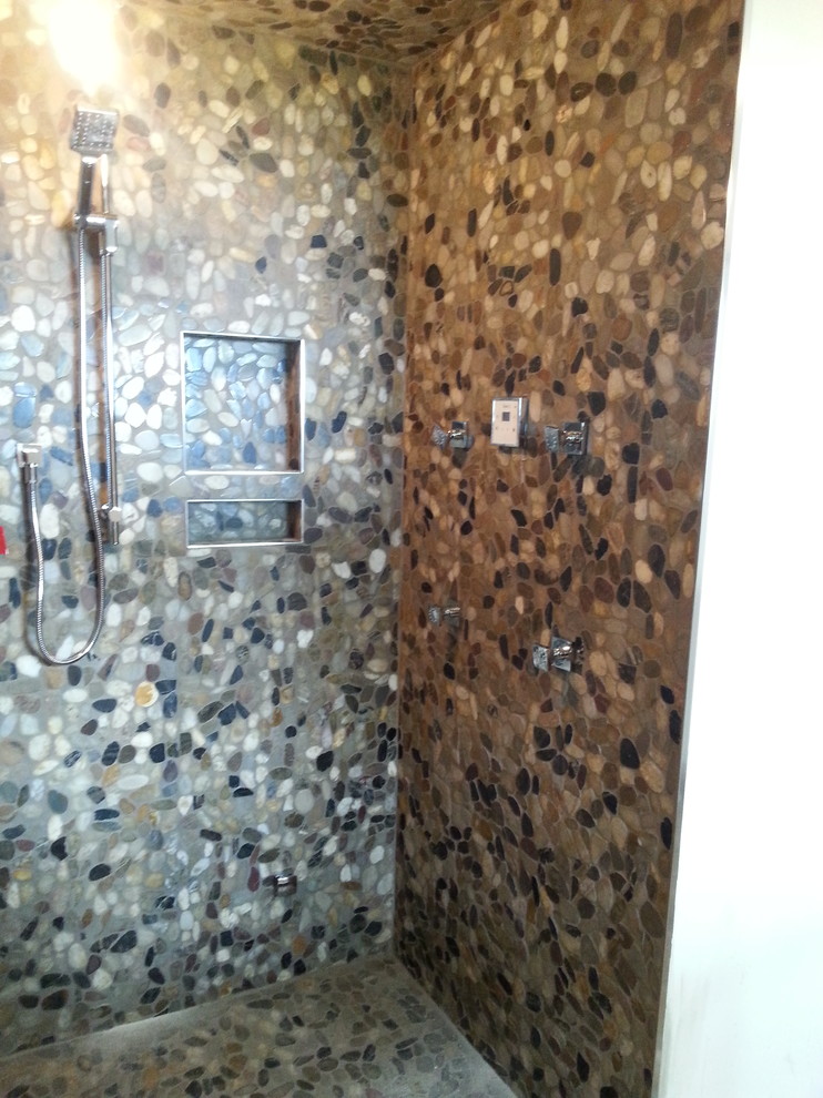 Large country master bathroom in Toronto with an alcove shower, multi-coloured tile, pebble tile and pebble tile floors.