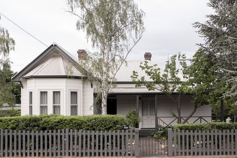 Inspiration for a victorian front door in Sydney with white walls.