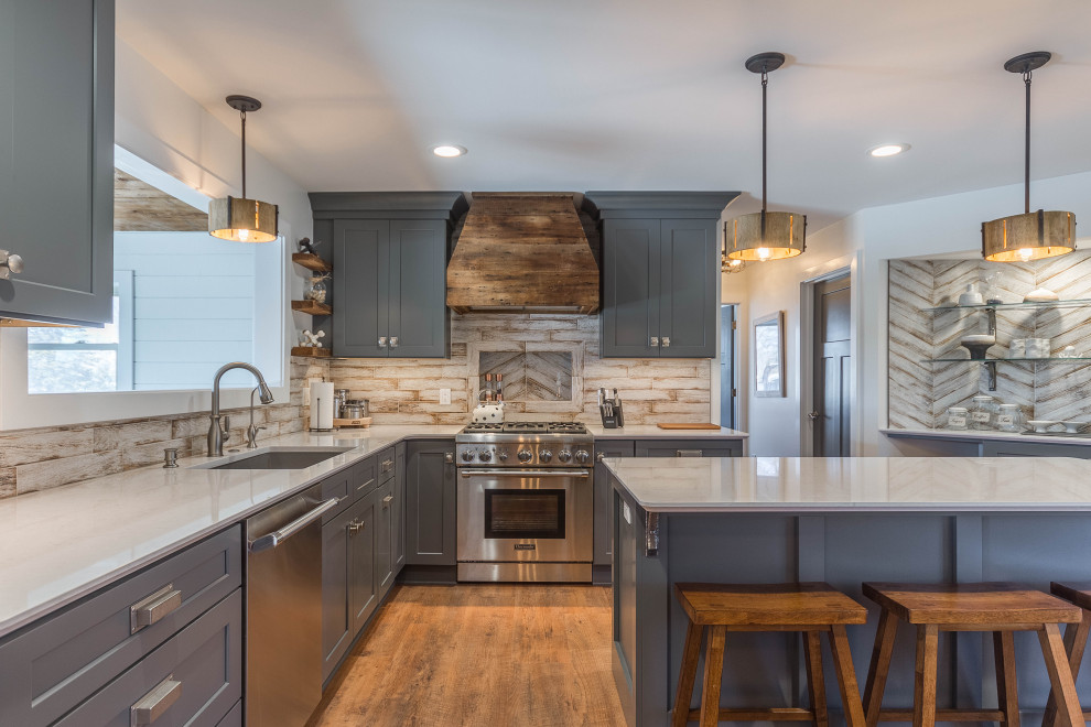 Mid-sized mountain style u-shaped vinyl floor, brown floor and wood ceiling eat-in kitchen photo in Detroit with an undermount sink, recessed-panel cabinets, gray cabinets, quartz countertops, beige backsplash, porcelain backsplash, stainless steel appliances, an island and white countertops