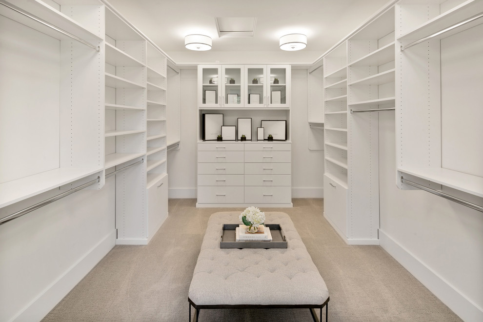Inspiration for a large country gender-neutral carpeted and gray floor walk-in closet remodel in Seattle with flat-panel cabinets and white cabinets