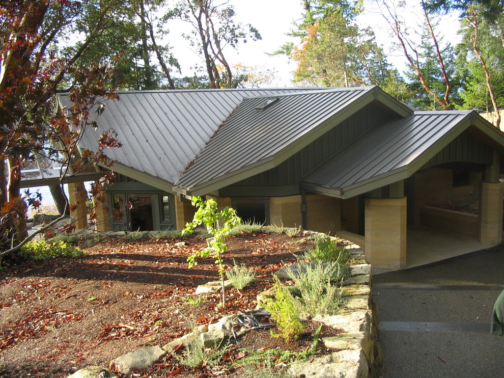 Example of a mid-sized trendy home design design in Vancouver