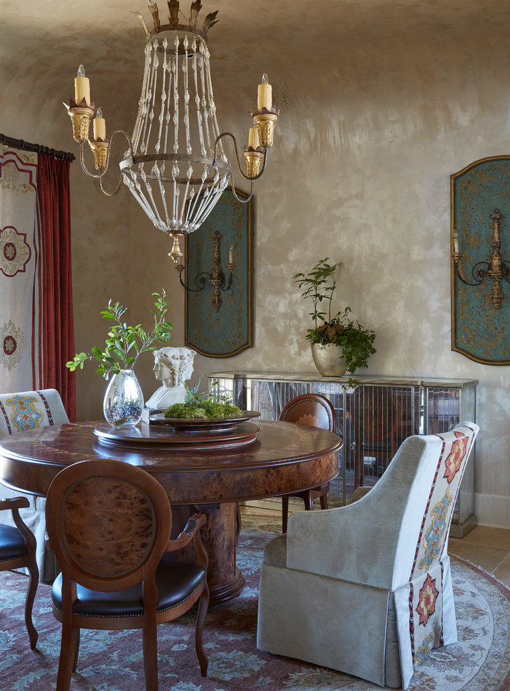 Inspiration for a mediterranean dining room in Houston with beige walls and beige floor.