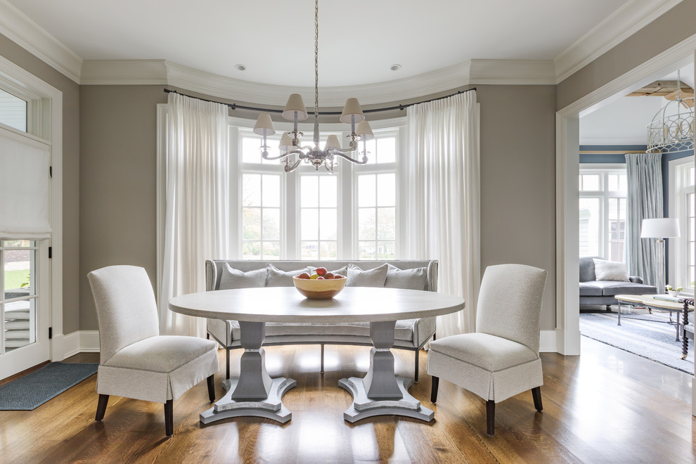Photo of a large traditional separate dining room in Chicago with medium hardwood floors and grey walls.