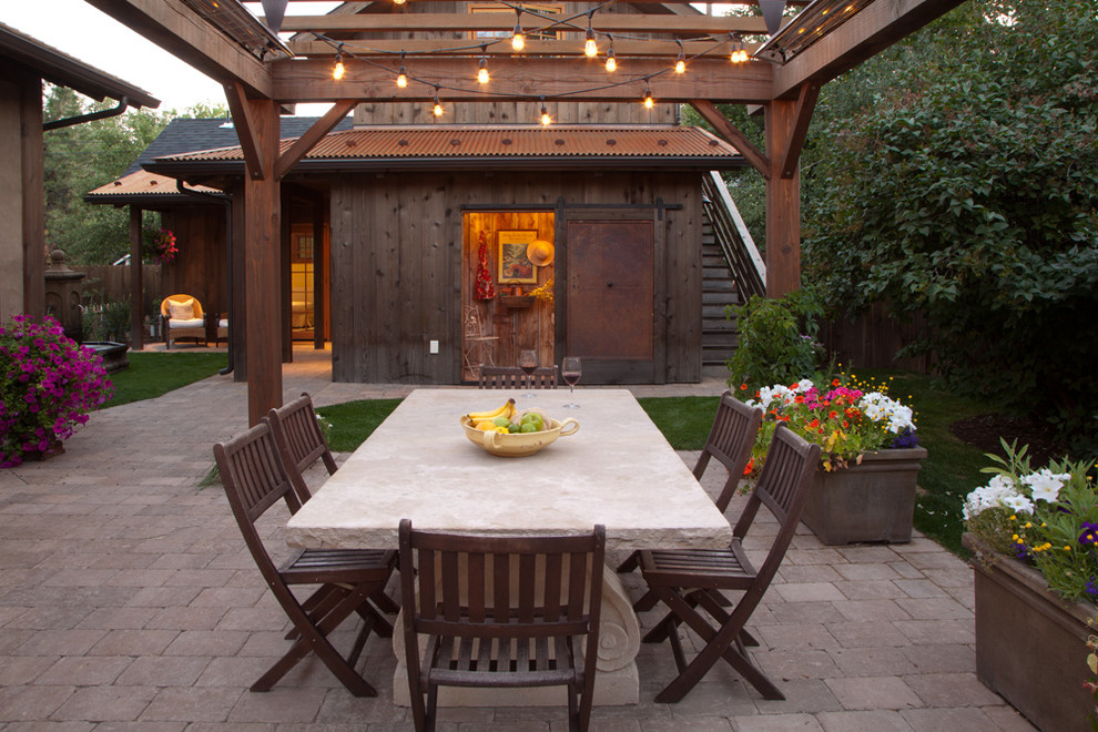 Inspiration for a country backyard patio in Other with a container garden and a pergola.