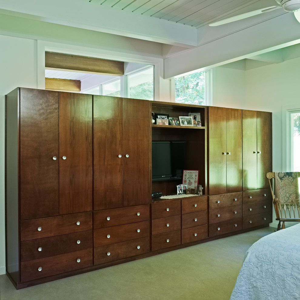 This is an example of a mid-sized midcentury master bedroom in Atlanta with white walls and carpet.