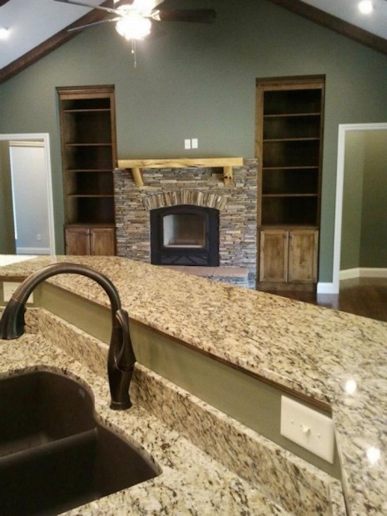 Eat-in kitchen - large galley eat-in kitchen idea with a drop-in sink, beaded inset cabinets, medium tone wood cabinets, beige backsplash, stainless steel appliances and an island