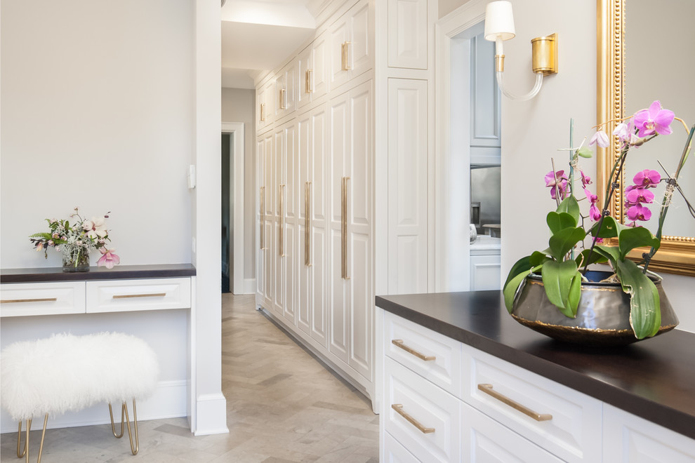 Small transitional limestone floor and gray floor mudroom photo in Richmond with gray walls and a white front door