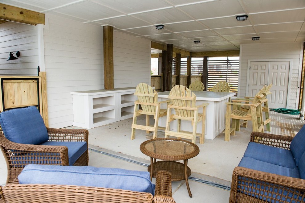 Inspiration for a mid-sized transitional backyard concrete patio remodel with a roof extension
