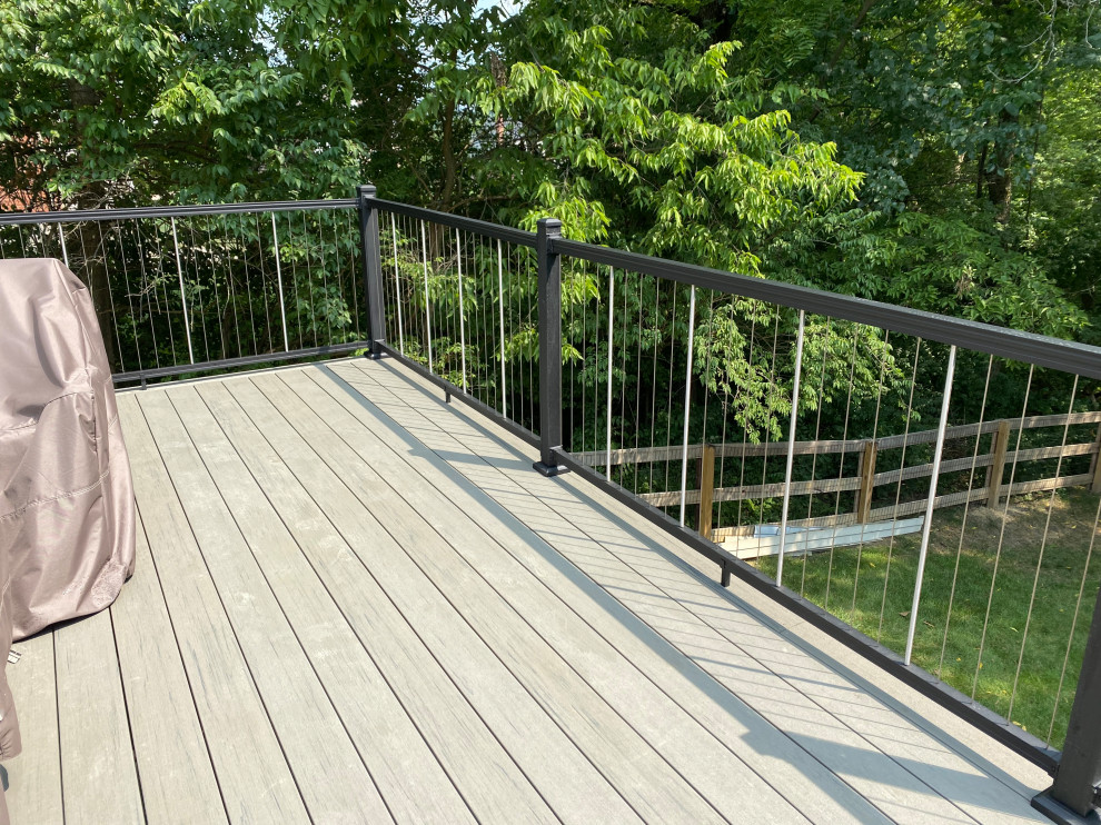 Large transitional backyard second story metal railing deck photo in Cincinnati