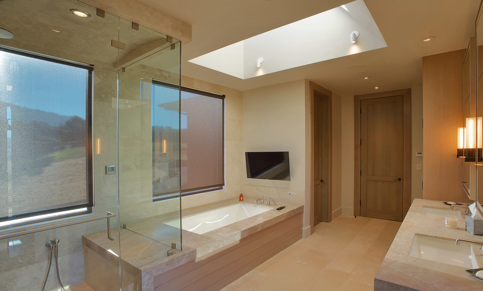This is an example of an expansive contemporary master bathroom in San Francisco with an undermount sink, granite benchtops, an undermount tub, an open shower, beige tile and beige walls.