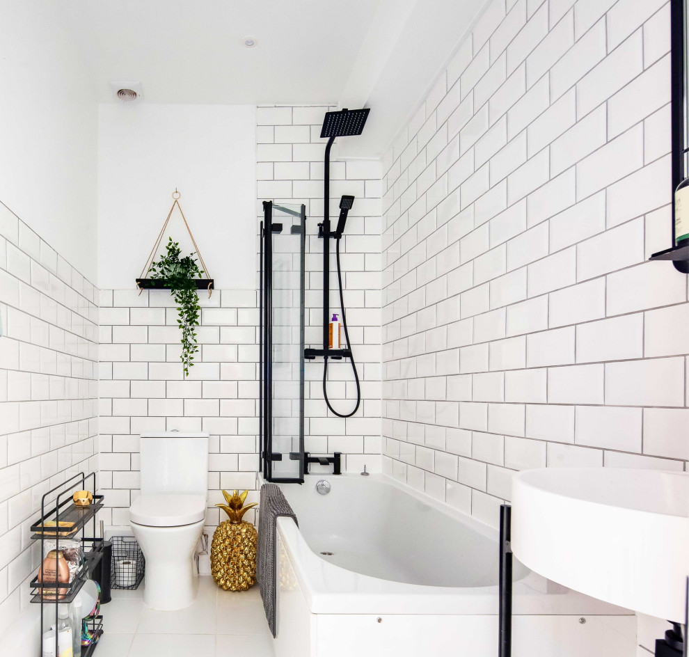 Photo of a mid-sized contemporary kids bathroom in London with subway tile.