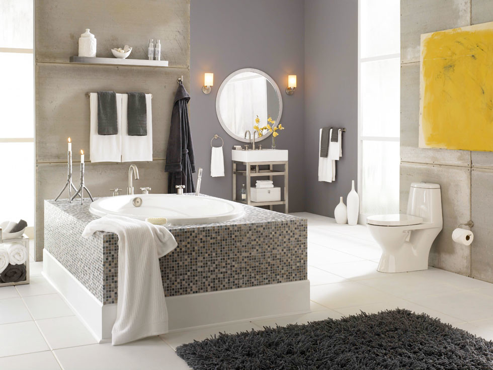 Photo of a mid-sized transitional master bathroom in Other with a one-piece toilet, gray tile, open cabinets, a drop-in tub, cement tile, grey walls, ceramic floors, a console sink, solid surface benchtops and white floor.