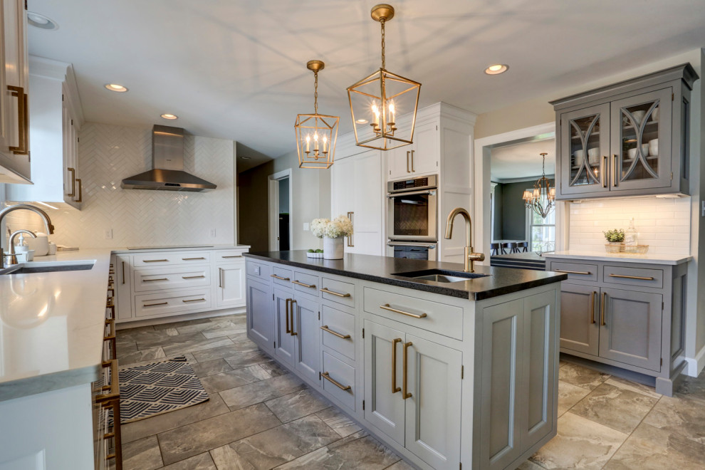 Example of a large galley open concept kitchen design with two islands