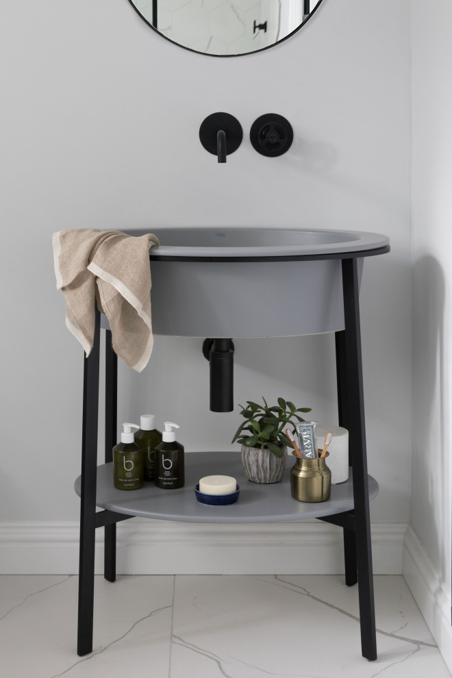 This is an example of a small modern kids bathroom in Sussex with furniture-like cabinets, grey cabinets, a freestanding tub, an open shower and an open shower.