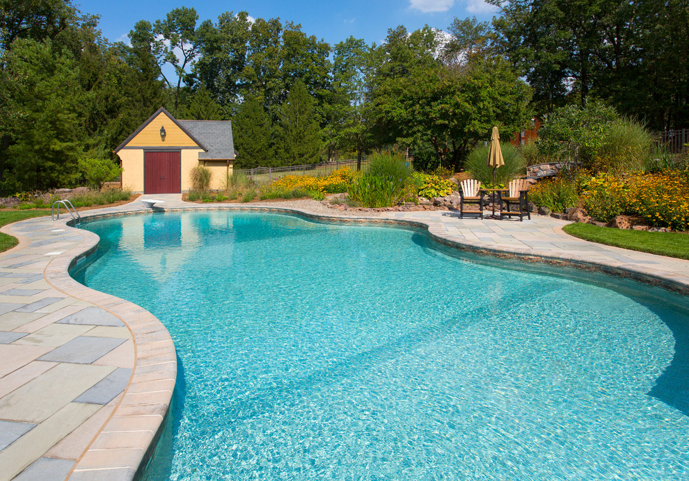 Pool house - mid-sized transitional backyard tile and kidney-shaped pool house idea