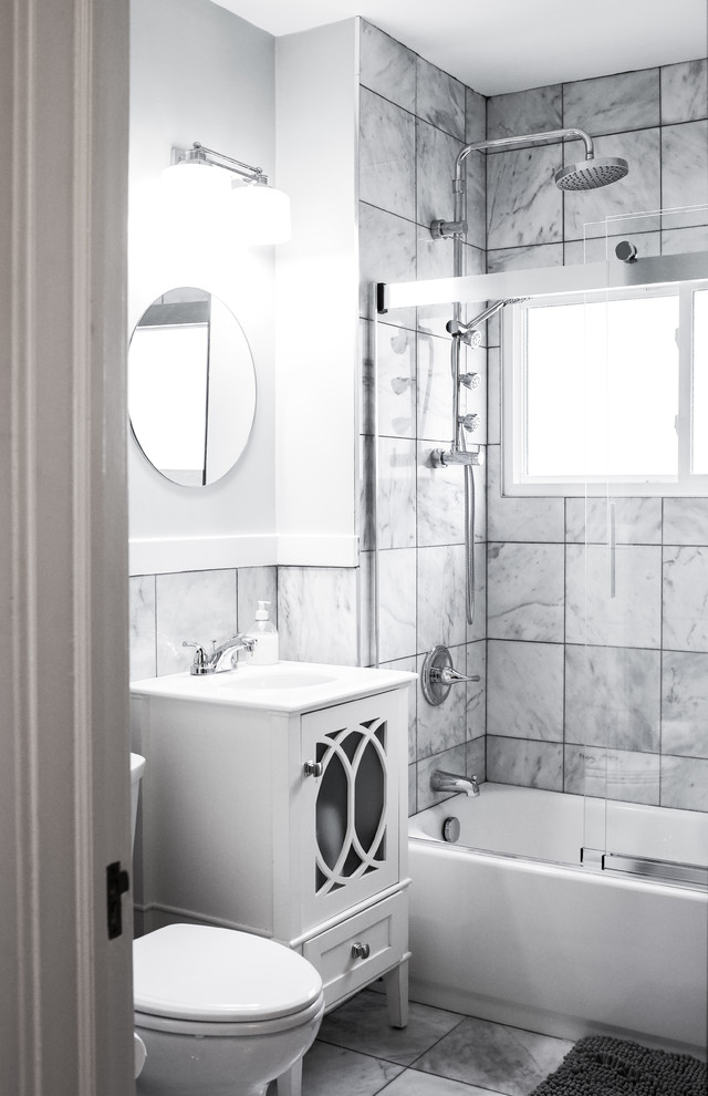 Alcove bathtub - small transitional gray tile and marble tile marble floor and gray floor alcove bathtub idea with furniture-like cabinets, white cabinets, a two-piece toilet, gray walls, a console sink, quartz countertops and white countertops