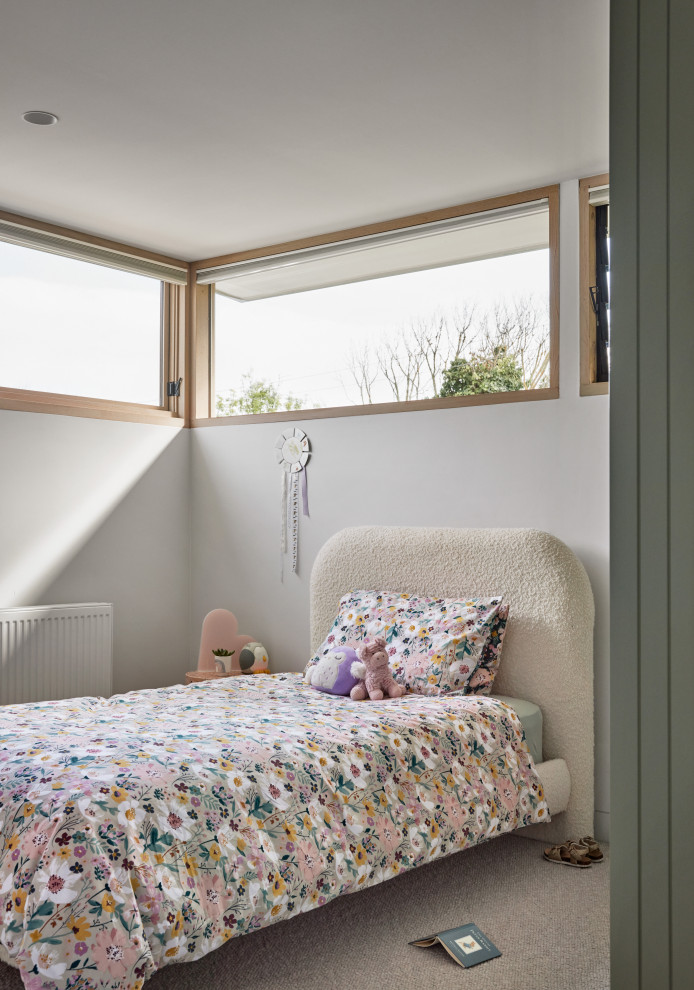 Example of a mid-sized beach style carpeted kids' bedroom design in Melbourne with white walls
