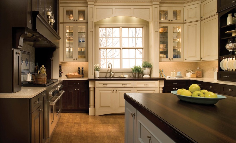 Design ideas for a traditional kitchen in Orange County with raised-panel cabinets.