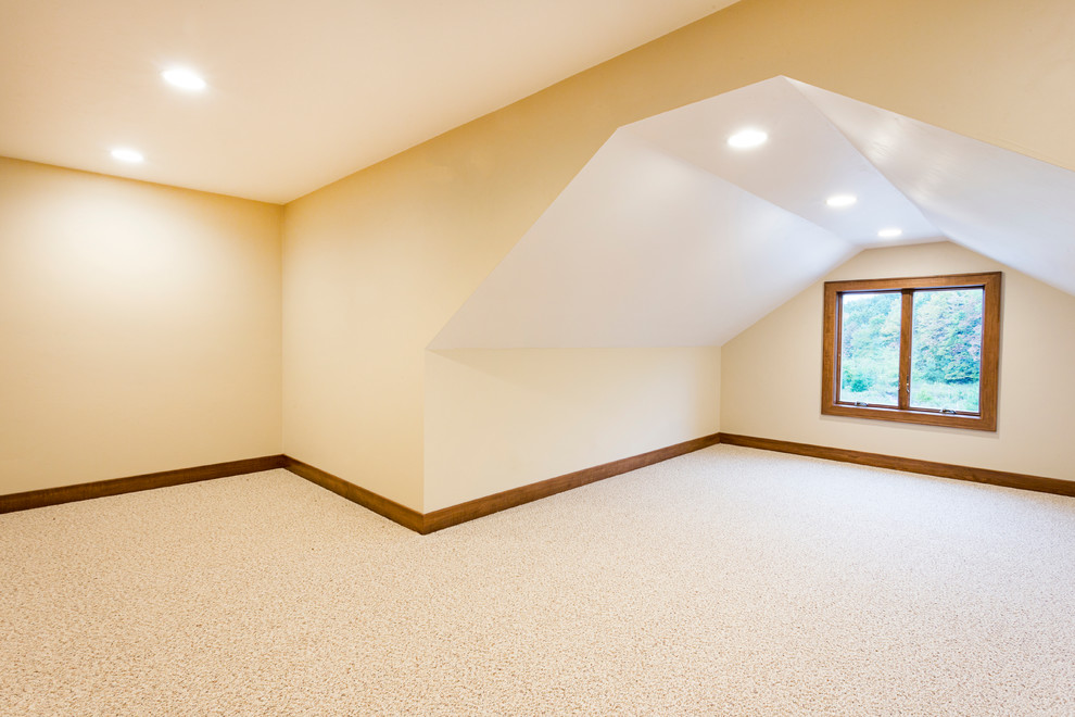 Photo of a mid-sized arts and crafts guest bedroom in Other with beige walls and carpet.