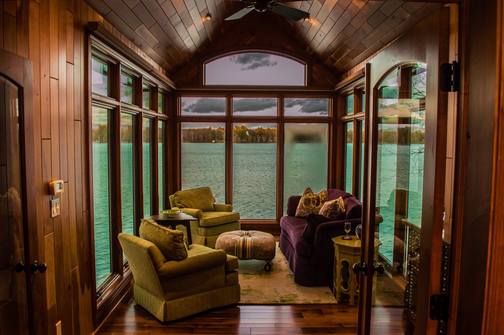 Photo of a traditional sunroom in Minneapolis with medium hardwood floors and brown floor.