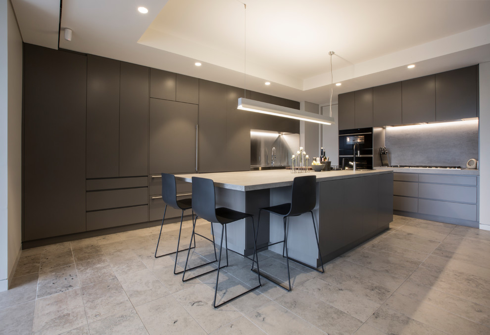 This is an example of a contemporary l-shaped kitchen in Sydney with flat-panel cabinets, grey cabinets, grey splashback, panelled appliances, with island and grey floor.