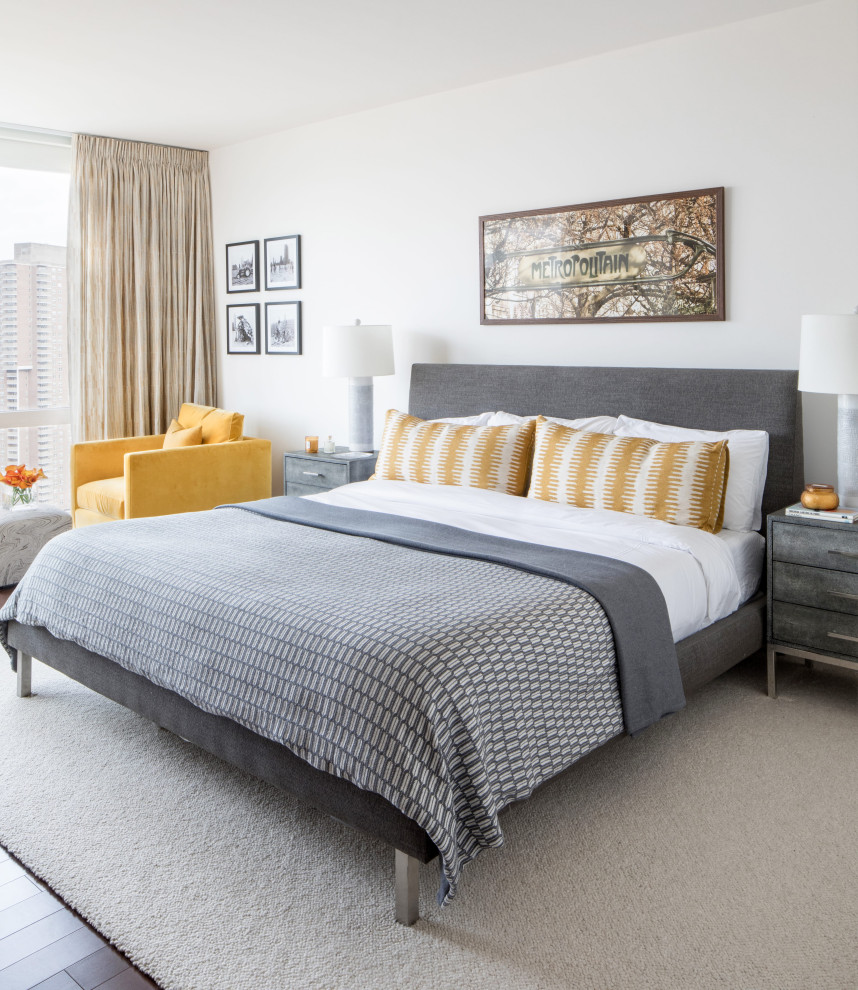 Design ideas for a contemporary grey and yellow bedroom in New York with white walls, dark hardwood flooring and brown floors.