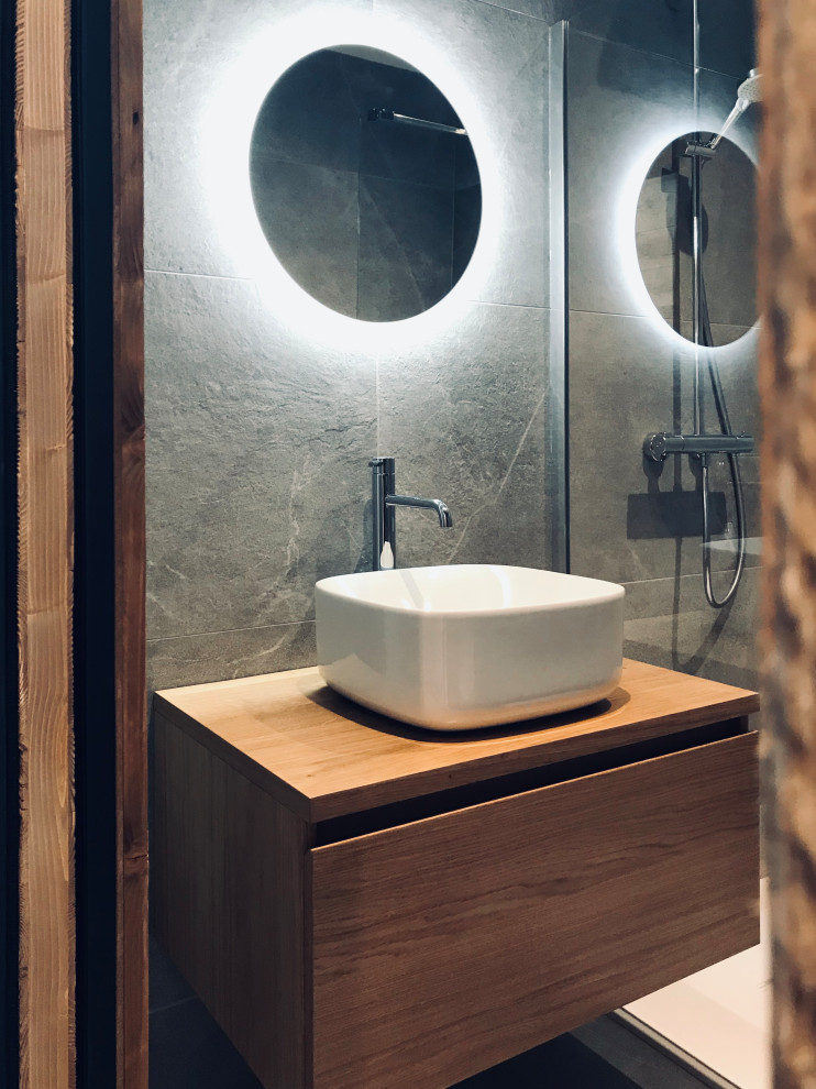This is an example of a small rustic shower room bathroom in Lyon with a built-in shower, grey tiles, stone tiles, grey walls, a built-in sink, wooden worktops, beige worktops, a single sink and a floating vanity unit.