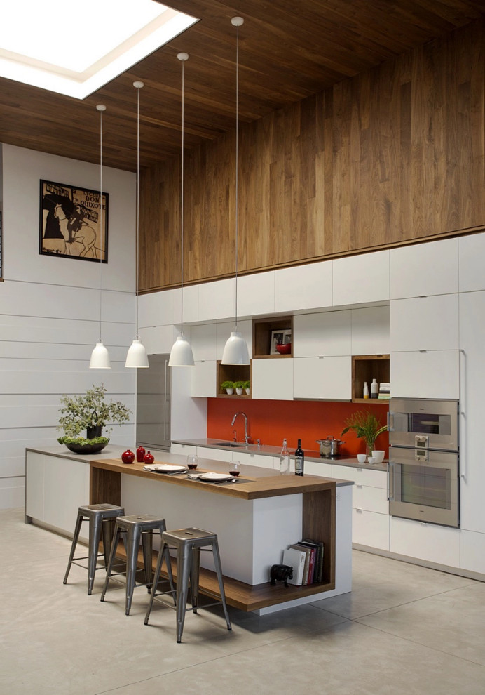 Inspiration for an urban kitchen in Boston with stainless steel appliances and an island.