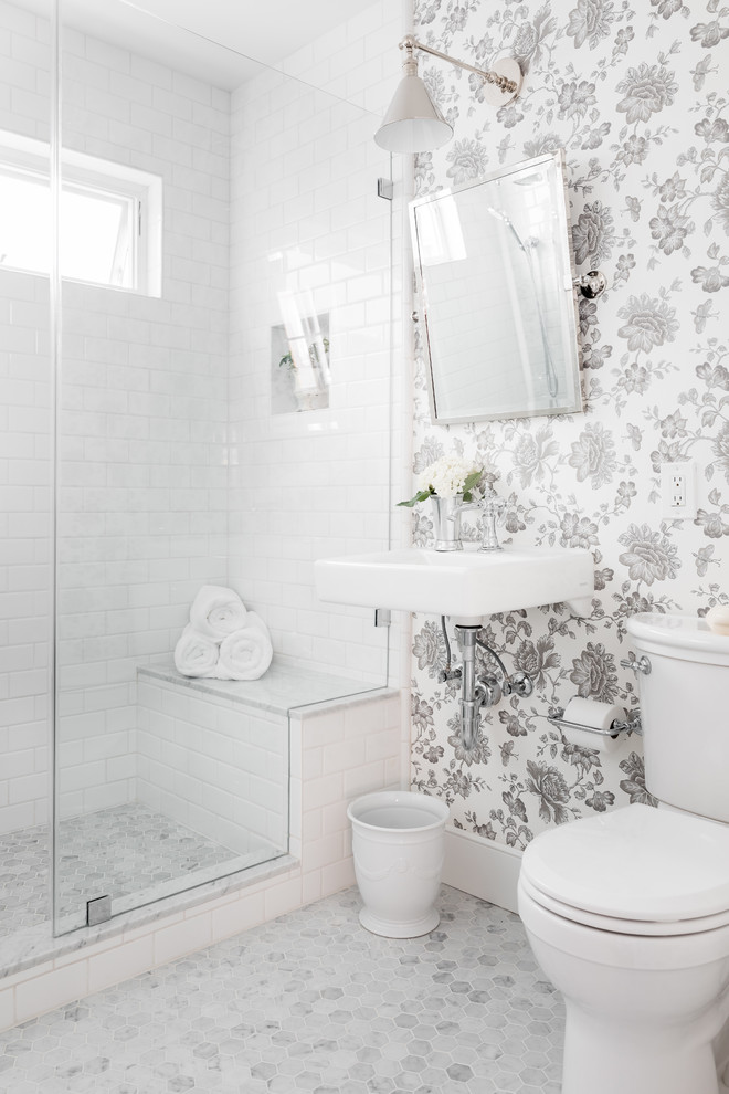 Inspiration for a transitional powder room in Sacramento with white tile, subway tile, a wall-mount sink and white floor.