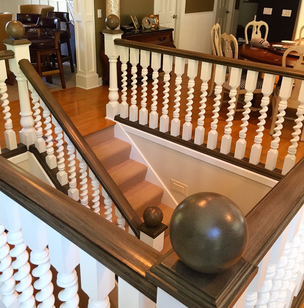 Example of a mid-sized classic carpeted wood railing staircase design in Houston with carpeted risers