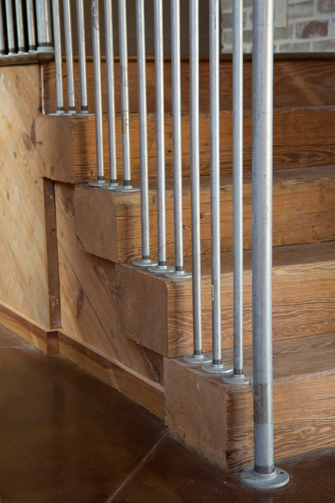 Staircase - large industrial wooden straight metal railing staircase idea in Houston with wooden risers