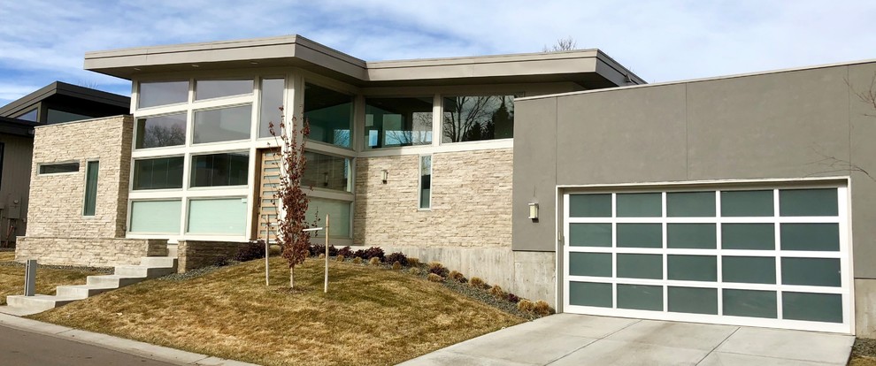 Inspiration for a mid-sized contemporary attached two-car garage in Denver.