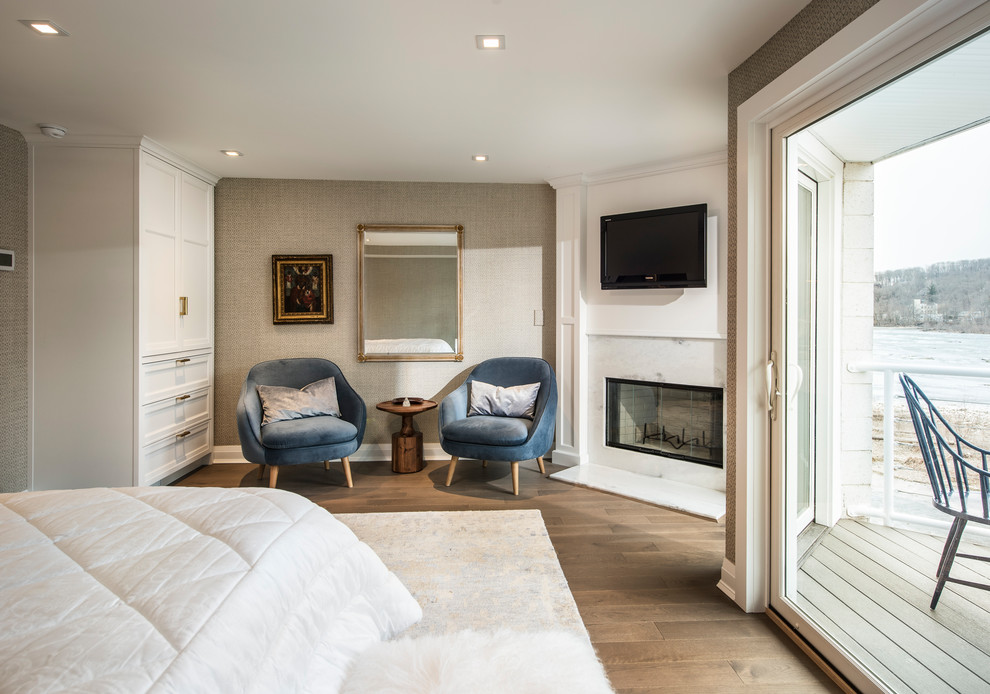 Photo of a mid-sized transitional master bedroom in Philadelphia with beige walls, medium hardwood floors, a corner fireplace and a wood fireplace surround.