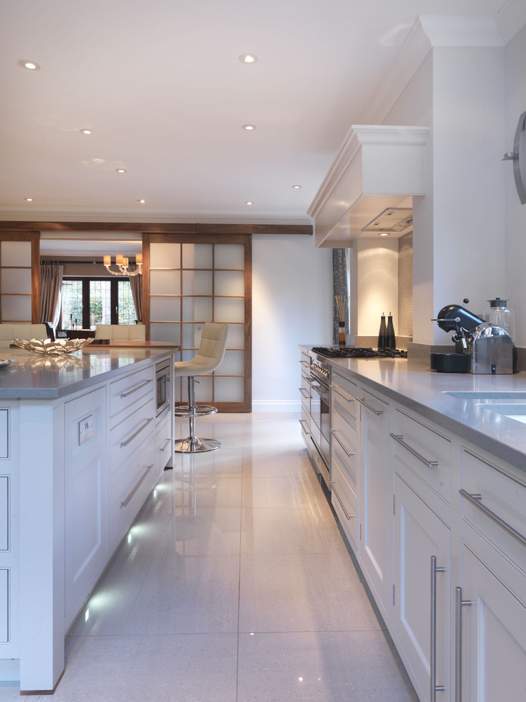 Design ideas for a large contemporary u-shaped eat-in kitchen in Hampshire with a drop-in sink, shaker cabinets, grey cabinets, quartz benchtops, metallic splashback, metal splashback, stainless steel appliances, ceramic floors and with island.