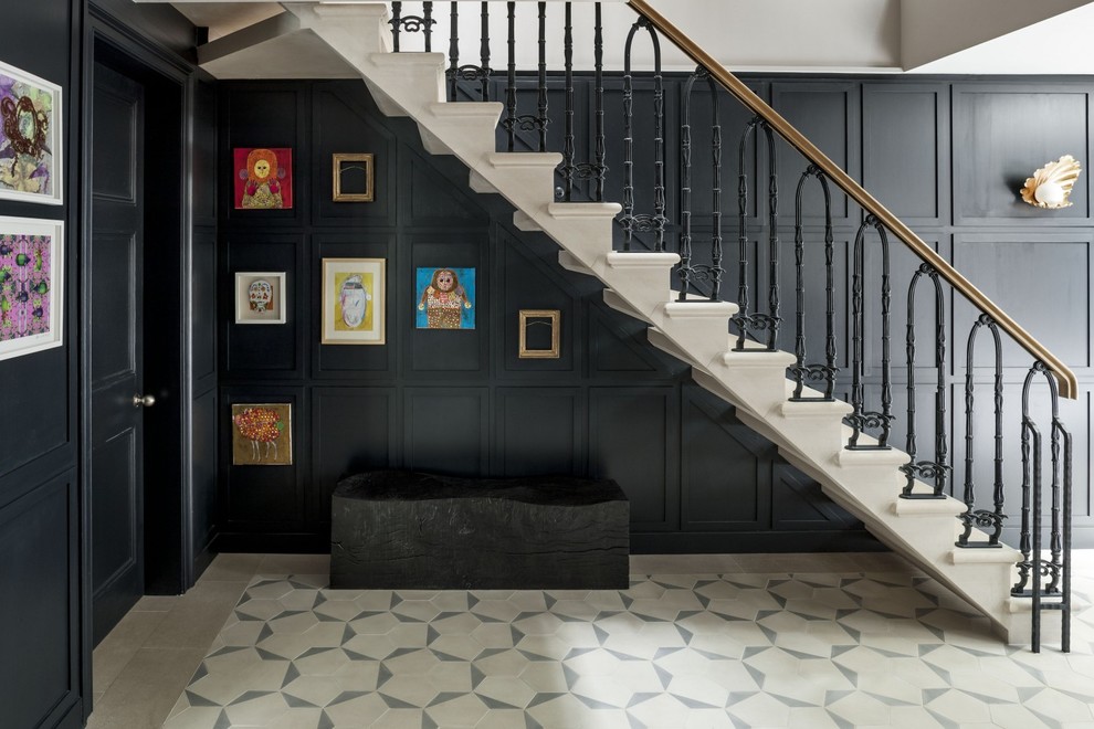 Design ideas for a mid-sized traditional straight staircase in London.