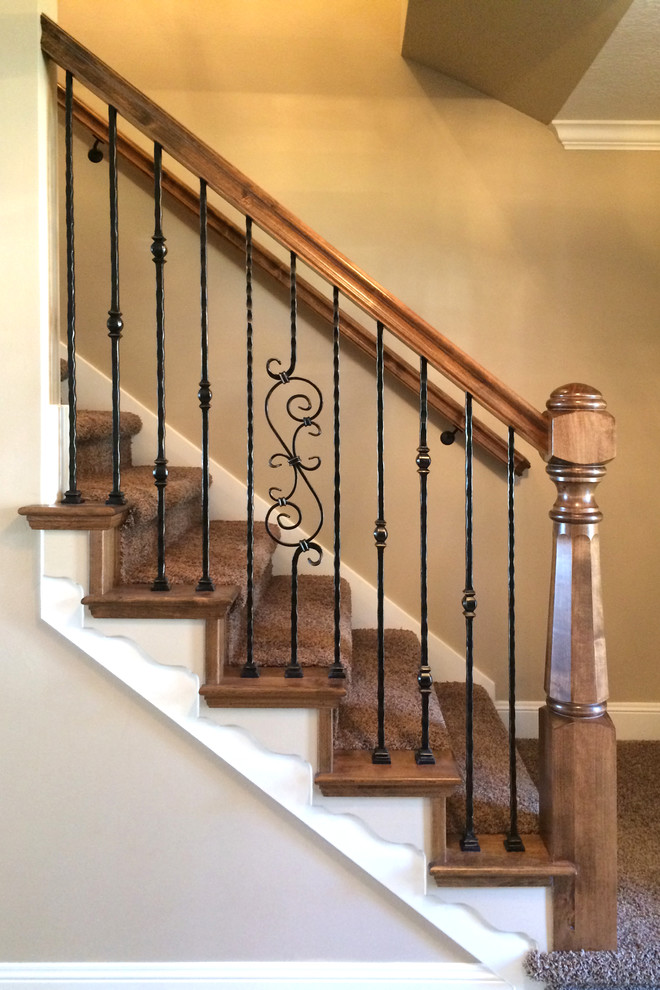 Inspiration for a small timeless wooden straight carpeted staircase remodel in Salt Lake City with beige walls and wooden risers